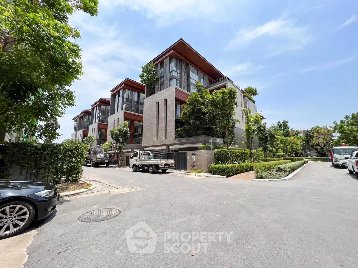 Modern luxury residential building with lush greenery and spacious design
