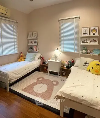 Charming children's bedroom with twin beds and playful decor
