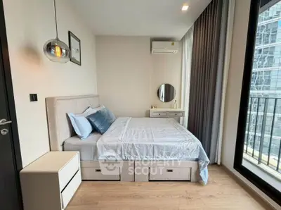 Modern bedroom with balcony view in high-rise apartment