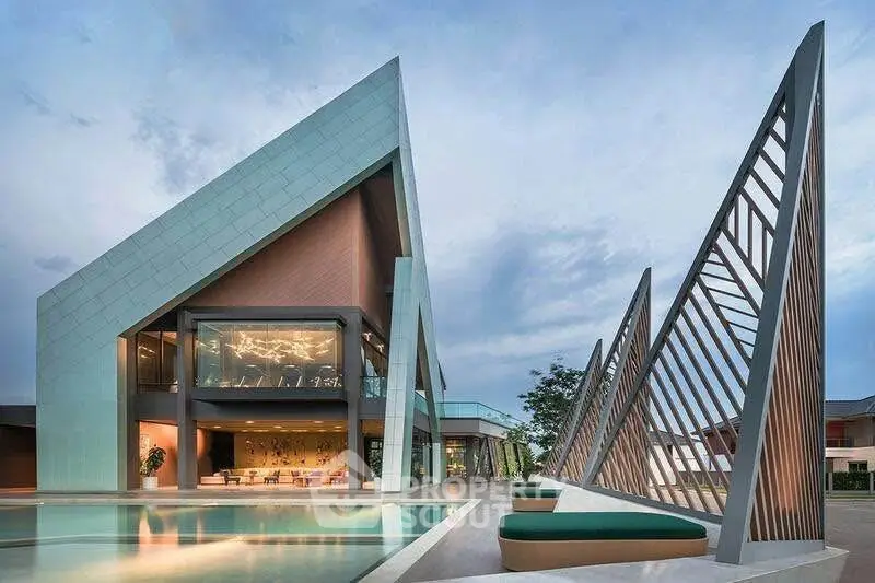 Stunning modern architectural home with unique design and luxurious pool area.