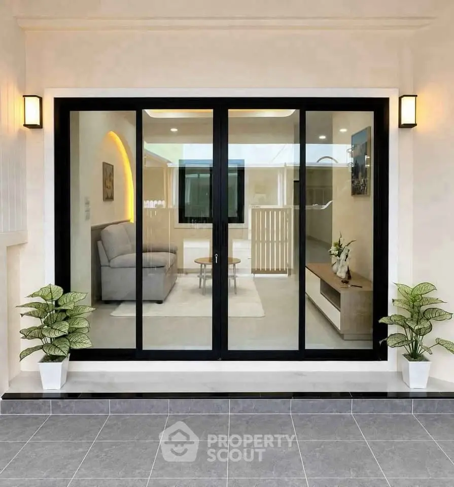 Modern living room with sliding glass doors and elegant interior design