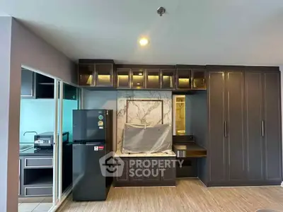 Modern kitchen with sleek cabinetry and built-in appliances in a stylish apartment.