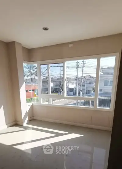 Bright corner unit with large windows offering urban views, perfect for natural light lovers.