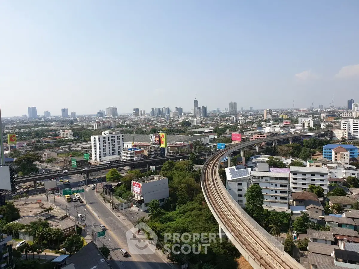 Stunning cityscape view with elevated train tracks and skyline