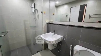 Modern bathroom with sleek design and glass shower enclosure