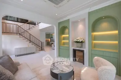 Luxurious living room with elegant staircase and modern decor