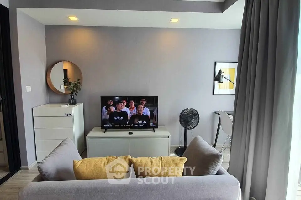 Modern living room with stylish decor and cozy seating area, perfect for relaxation and entertainment.