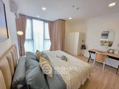 Spacious modern bedroom with elegant decor and natural light