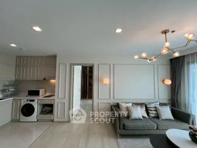 Modern living room with stylish kitchen and elegant lighting