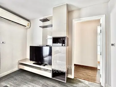 Modern living room with sleek TV unit and air conditioning