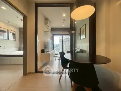 Modern apartment interior with open layout, featuring a cozy living area and dining space with city view.
