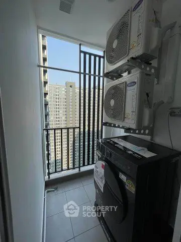 Modern apartment balcony with stacked air conditioning units and city view.