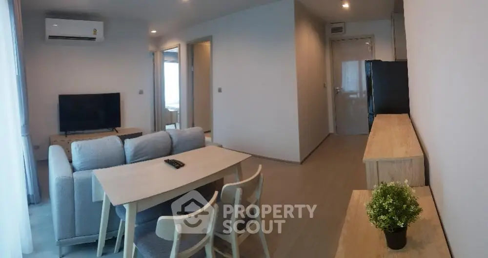 Modern living room with cozy furniture and sleek design, perfect for urban living.