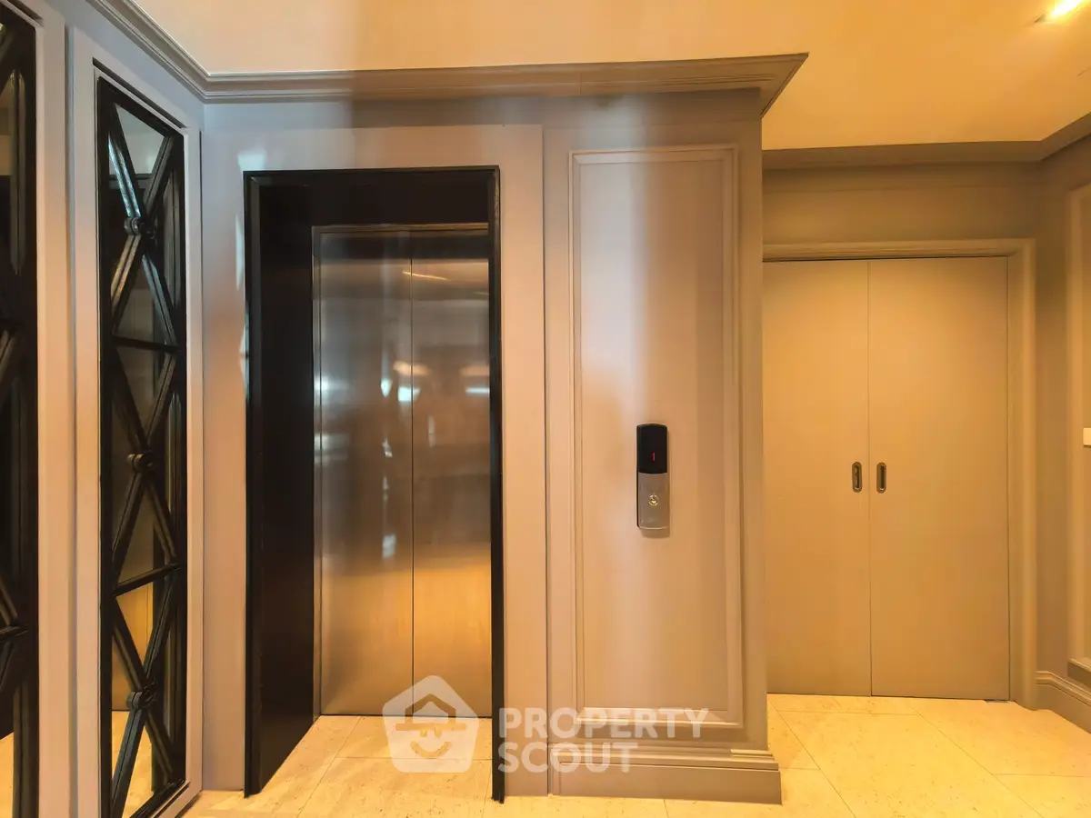 Elegant modern elevator lobby with sleek design and ambient lighting