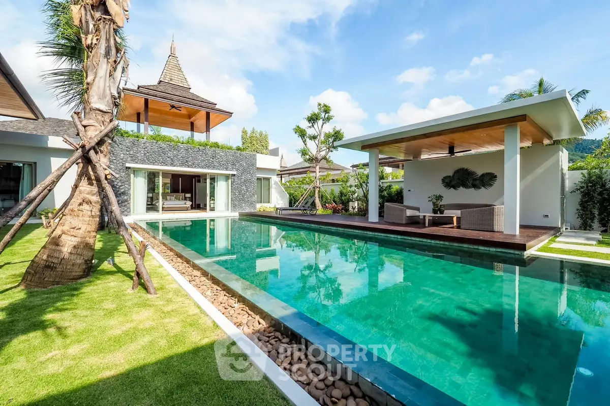 Luxurious villa with private pool and lush garden, perfect for tropical living.
