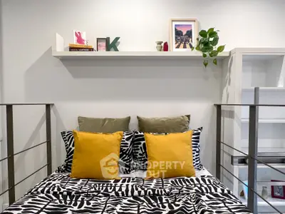 Stylish bedroom with modern decor and vibrant cushions