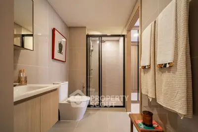 Modern bathroom with sleek design and glass shower enclosure