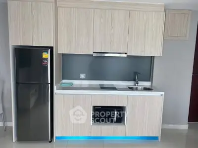 Modern kitchen with sleek cabinetry and built-in appliances