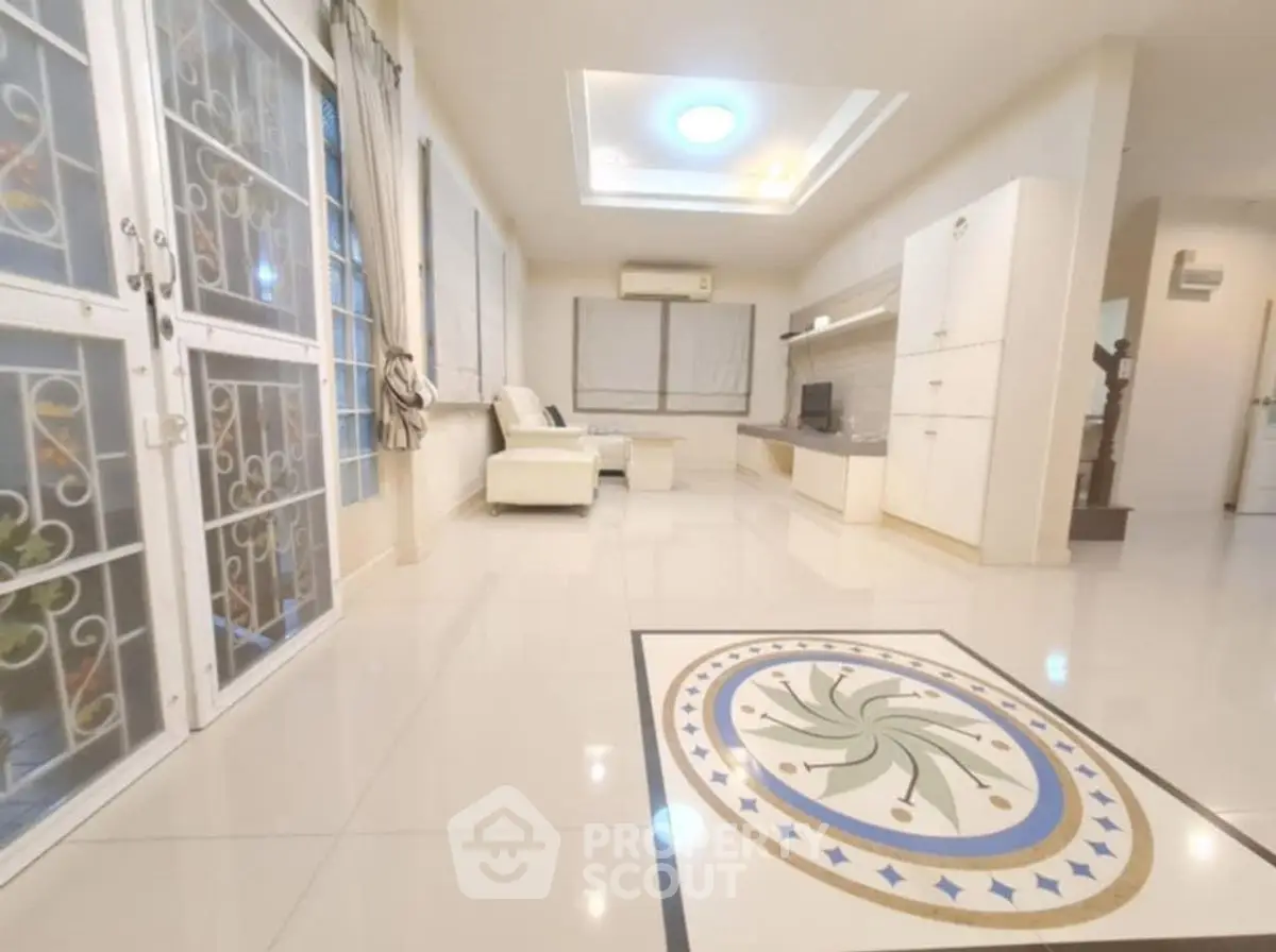 Spacious living room with elegant tile design and modern decor