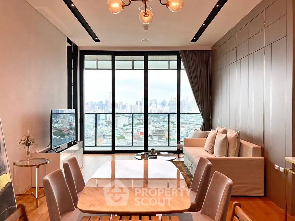 Luxurious living room with stunning city view, modern furniture, and elegant decor in high-rise apartment.