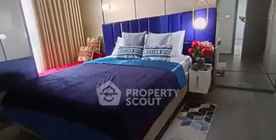 Luxurious bedroom with modern decor and plush bedding in a stylish apartment.