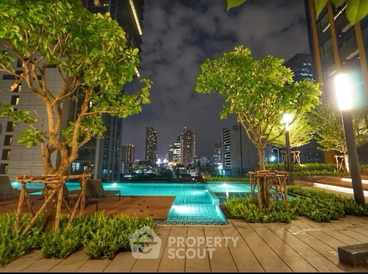 Luxurious rooftop pool with stunning city skyline view at night
