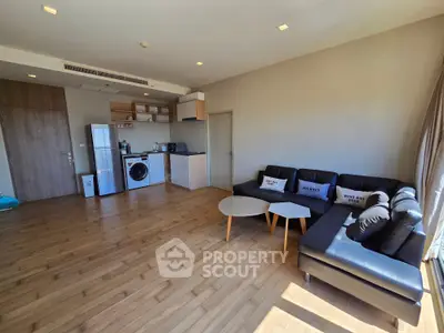 Spacious modern living room with open kitchen and stylish furniture