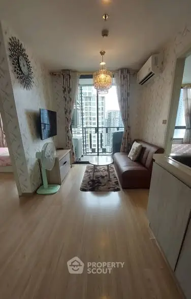 Modern living room with balcony view in high-rise apartment