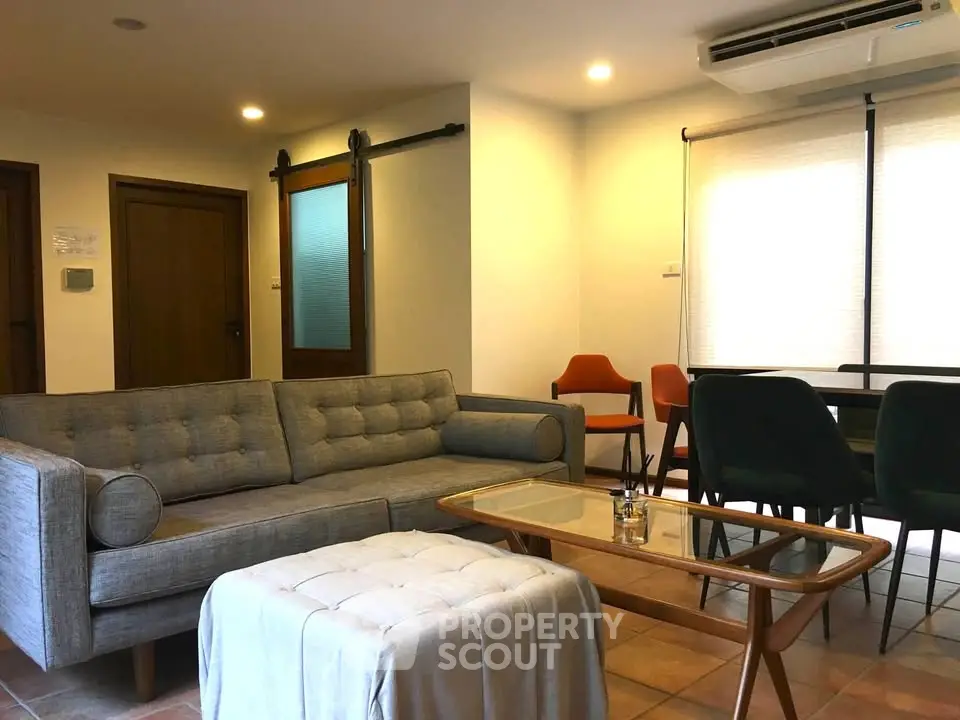 Stylish living room with modern furniture and natural light, perfect for relaxation and entertaining.