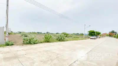 Spacious vacant land plot with road access and greenery, ideal for development opportunities.