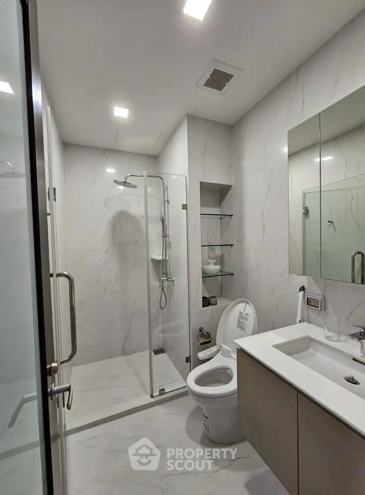 Modern bathroom with sleek design and glass shower enclosure