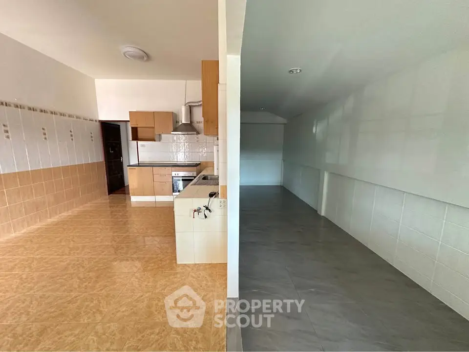 Spacious kitchen with open layout and modern appliances in a bright apartment.