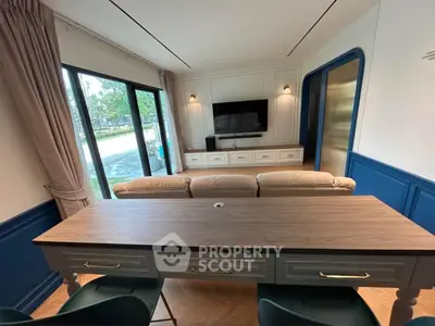 Stylish living room with modern decor, large windows, and elegant furniture, perfect for relaxation and entertainment.