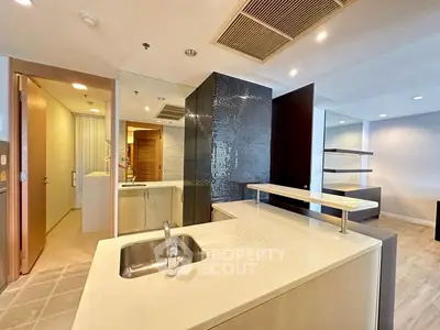 Modern open-layout kitchen with sleek design and integrated sink