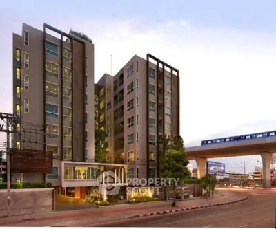 Modern urban apartment building with sleek design near public transit, ideal for city living.