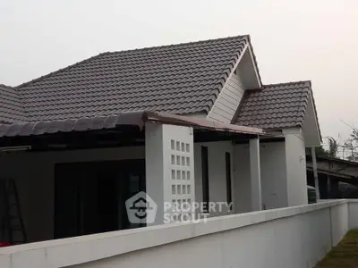 Charming single-story home with modern roof design and spacious exterior.