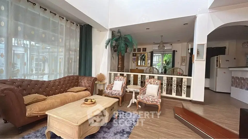 Charming living room with vintage furniture and open layout, perfect for cozy gatherings.