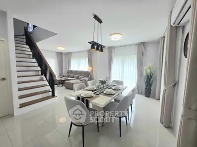 Spacious modern living and dining area with elegant decor and natural light