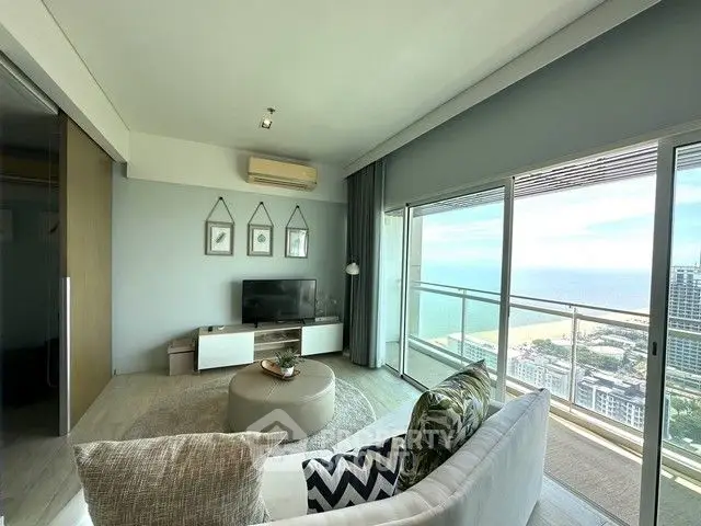 Stunning living room with panoramic ocean view and modern decor
