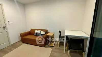 Cozy living room with brown sofa and dining table in modern apartment