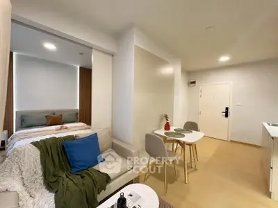 Modern studio apartment with cozy living area and stylish bedroom