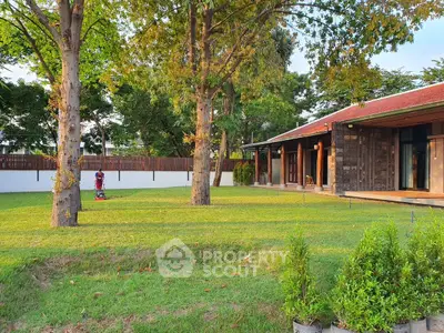 Charming suburban home with lush garden and spacious lawn, perfect for outdoor relaxation.