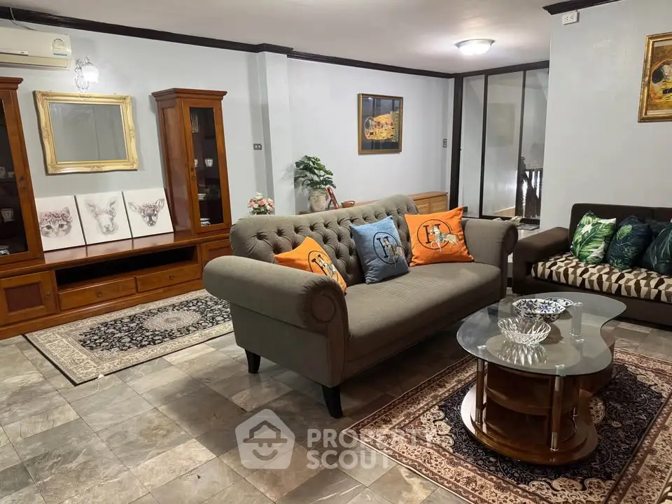 Charming living room with elegant furniture and cozy decor, perfect for relaxation and entertaining.