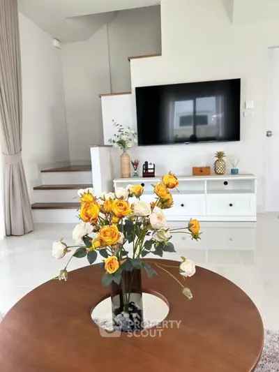Modern living room with stylish decor and flat-screen TV