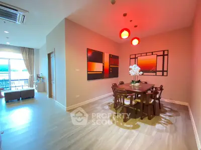 Spacious dining area with modern decor and natural light in a stylish apartment.
