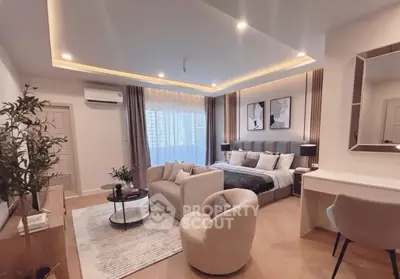 Luxurious modern bedroom with elegant decor and cozy seating area