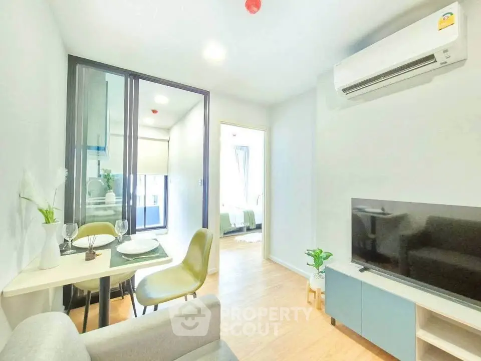 Modern living room with dining area and air conditioning in a bright apartment