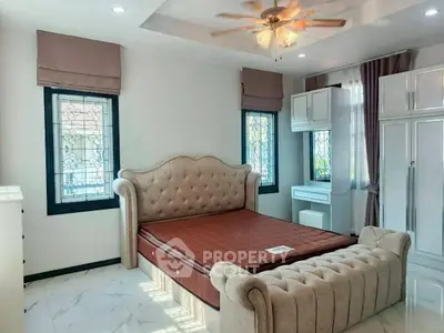 Luxurious bedroom with elegant furnishings and natural light