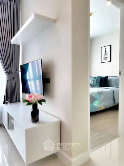 Modern apartment interior with stylish living room and cozy bedroom view, featuring elegant decor and natural light.