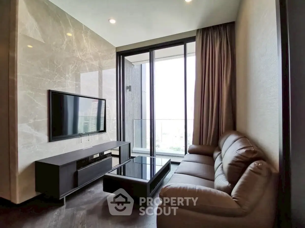 Luxurious living room with modern decor and stunning city view from large windows.